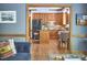 Modern kitchen with wood cabinets, granite island, and black appliances at 8407 Millers Bnd, Bahama, NC 27503