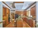 Well-equipped kitchen with wood cabinets, granite countertops, and stainless appliances at 8407 Millers Bnd, Bahama, NC 27503