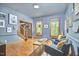 Spacious living room boasts hardwood floors, lots of natural light, and comfortable seating at 8407 Millers Bnd, Bahama, NC 27503