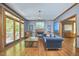 Inviting living room with fireplace, deck access, and hardwood flooring at 8407 Millers Bnd, Bahama, NC 27503