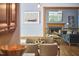 Inviting living room with fireplace, wood trim, and hardwood floors is accessed through the dining area at 8407 Millers Bnd, Bahama, NC 27503