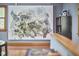 Living area showcasing neutral walls, hardwood floors, and a large art piece above the base trim molding at 8407 Millers Bnd, Bahama, NC 27503