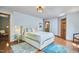 Spacious main bedroom with hardwood floors, a plush bed, and ample natural light at 8407 Millers Bnd, Bahama, NC 27503
