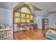 Office area with hardwood floors, large window, and a built-in desk perfect for working from home at 8407 Millers Bnd, Bahama, NC 27503