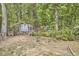 Backyard with storage sheds that provides ample storage for gardening equipment at 8407 Millers Bnd, Bahama, NC 27503