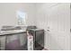 Laundry room featuring a washer, dryer, window, and a white door at 909 Starkland Way, Holly Springs, NC 27540