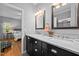 Elegant bathroom with a double vanity, marble countertops, and modern fixtures at 910 S Third St, Mebane, NC 27302