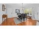 Bright dining room featuring hardwood floors, dining table, and natural light from the windows at 910 S Third St, Mebane, NC 27302