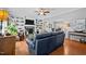 Spacious living room features hardwood floors, a fireplace, built-in shelving and a view of dining area at 910 S Third St, Mebane, NC 27302