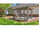 Inviting pergola with outdoor dining set, perfect for enjoying the beautifully landscaped backyard at 910 S Third St, Mebane, NC 27302