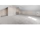 A large bonus room has neutral carpeting, bright recessed lighting and a staircase at 9200 Otter Ct, Middlesex, NC 27557