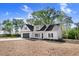 New construction home features a clean white exterior, black shutters and black garage door at 9200 Otter Ct, Middlesex, NC 27557