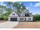 Charming new construction home with a spacious lawn and a two-car garage at 9200 Otter Ct, Middlesex, NC 27557