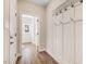 Hallway featuring wood flooring and coat hooks at 9200 Otter Ct, Middlesex, NC 27557