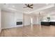 Bright, open living area with hardwood floors, fireplace, and modern lighting at 9200 Otter Ct, Middlesex, NC 27557