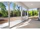 Relaxing screened-in patio with views of the lush backyard and surrounding trees at 9200 Otter Ct, Middlesex, NC 27557