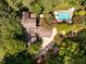 Aerial view showcases house, garden, pool, and manicured landscaping at 102 Antler Point Rd, Chapel Hill, NC 27516