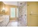 Elegant bathroom showcasing a marble walk-in shower, white cabinetry, and marble countertops at 102 Antler Point Rd, Chapel Hill, NC 27516