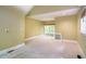 Large bedroom has plush carpet, a fan, and natural light from three windows at 102 Antler Point Rd, Chapel Hill, NC 27516