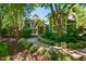 Charming home with lush landscaping and a welcoming walkway leading to the front door at 102 Antler Point Rd, Chapel Hill, NC 27516