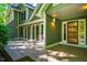 Exterior featuring a deck perfect for outdoor living, glass doors, and a well-maintained facade at 102 Antler Point Rd, Chapel Hill, NC 27516
