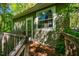 Exterior shot of an outbuilding with a wooden deck and siding at 102 Antler Point Rd, Chapel Hill, NC 27516