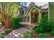 Beautiful home exterior featuring a spacious porch and a lush, green yard at 102 Antler Point Rd, Chapel Hill, NC 27516
