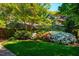 Well-kept lawn and vibrant flowerbeds enhance this attractive home's curb appeal at 102 Antler Point Rd, Chapel Hill, NC 27516