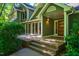 Home with a lovely porch, featuring an inviting front door and plenty of natural light at 102 Antler Point Rd, Chapel Hill, NC 27516