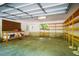 Spacious garage interior with shelving, a workbench, and ample storage space at 102 Antler Point Rd, Chapel Hill, NC 27516