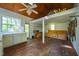 Unfinished interior of a cabin or outbuilding featuring unfinished floors and vaulted ceiling at 102 Antler Point Rd, Chapel Hill, NC 27516