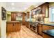 Well-equipped kitchen with a center island, modern appliances, and custom wood cabinets at 102 Antler Point Rd, Chapel Hill, NC 27516