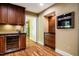 Kitchen showcases wood cabinets, a stainless steel oven, and a wine cooler for convenience and style at 102 Antler Point Rd, Chapel Hill, NC 27516