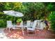 Outdoor dining area with built in grill at 102 Antler Point Rd, Chapel Hill, NC 27516