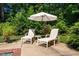 Seating area with chaise lounges poolside at 102 Antler Point Rd, Chapel Hill, NC 27516
