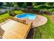 Pool with concrete patio, deck, and grassy area at 102 Traviliah Oaks Ln, Cary, NC 27518