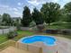 Backyard features an in-ground pool and wood deck, perfect for entertaining at 102 Traviliah Oaks Ln, Cary, NC 27518