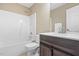 Bathroom featuring a shower-tub combo and vanity with sink at 102 Traviliah Oaks Ln, Cary, NC 27518