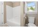 Full bathroom with a shower-tub combo and traditional toilet at 102 Traviliah Oaks Ln, Cary, NC 27518