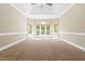 Spacious bedroom with vaulted ceilings and large bay windows overlooking backyard at 102 Traviliah Oaks Ln, Cary, NC 27518