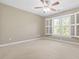 A bright bedroom with shuttered windows providing a view at 102 Traviliah Oaks Ln, Cary, NC 27518