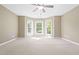 Neutral Primary bedroom with bay windows bringing natural light in at 102 Traviliah Oaks Ln, Cary, NC 27518