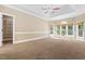 Large bedroom featuring vaulted ceilings and bright windows at 102 Traviliah Oaks Ln, Cary, NC 27518