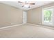 Bedroom with a ceiling fan, window, and neutral walls at 102 Traviliah Oaks Ln, Cary, NC 27518