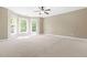 Bright and airy bedroom with three windows and neutral carpet at 102 Traviliah Oaks Ln, Cary, NC 27518