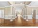 Inviting foyer with soaring ceilings, hardwood floors, and elegant architectural columns at 102 Traviliah Oaks Ln, Cary, NC 27518
