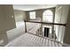 Foyer with white staircase, chandelier, and view of front door and large window at 102 Traviliah Oaks Ln, Cary, NC 27518