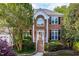 Beautiful brick two-story home with manicured landscaping and classic architectural details at 102 Traviliah Oaks Ln, Cary, NC 27518