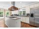 Gourmet kitchen island and stainless steel appliances at 102 Traviliah Oaks Ln, Cary, NC 27518