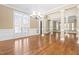 Spacious living area with hardwood floors, recessed lighting, and ample natural light at 102 Traviliah Oaks Ln, Cary, NC 27518